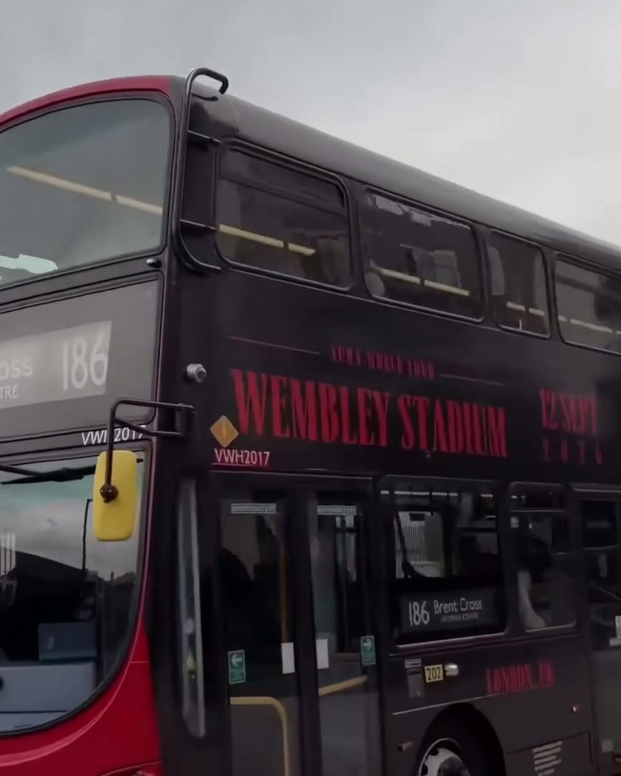 Front of the north-west London bus approaching, unwrapped front with the wrapped side visible