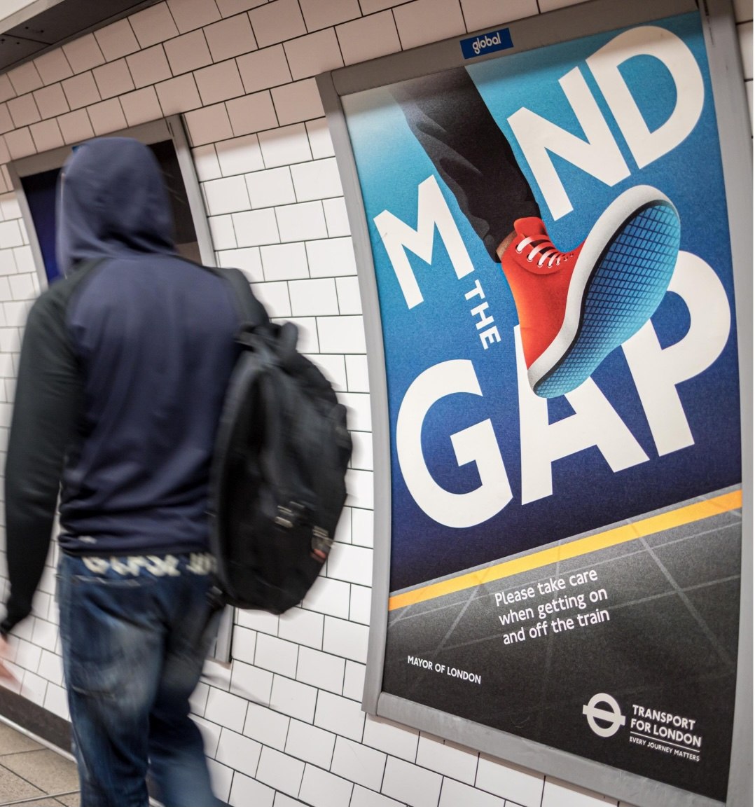 4 Sheet tube advertising poster in London Underground corridor