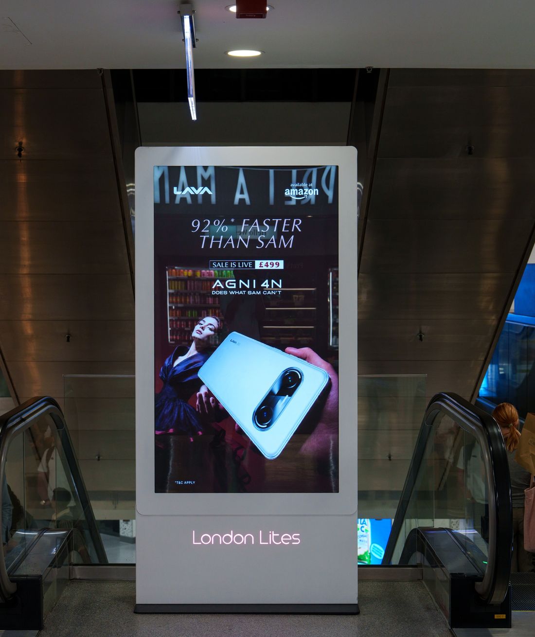 The LAVA advert on the freestanding screen between the escalators at Bond Street station