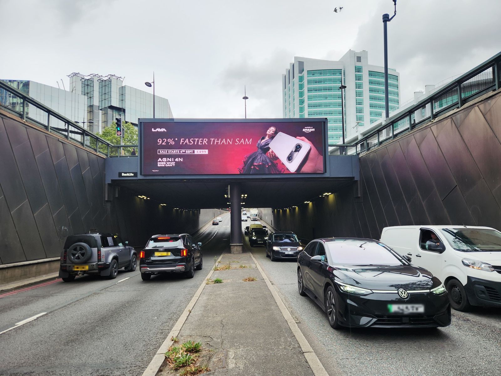 The LAVA advert on the bridge screen over the Euston Road underpass, seen from the road on launch day